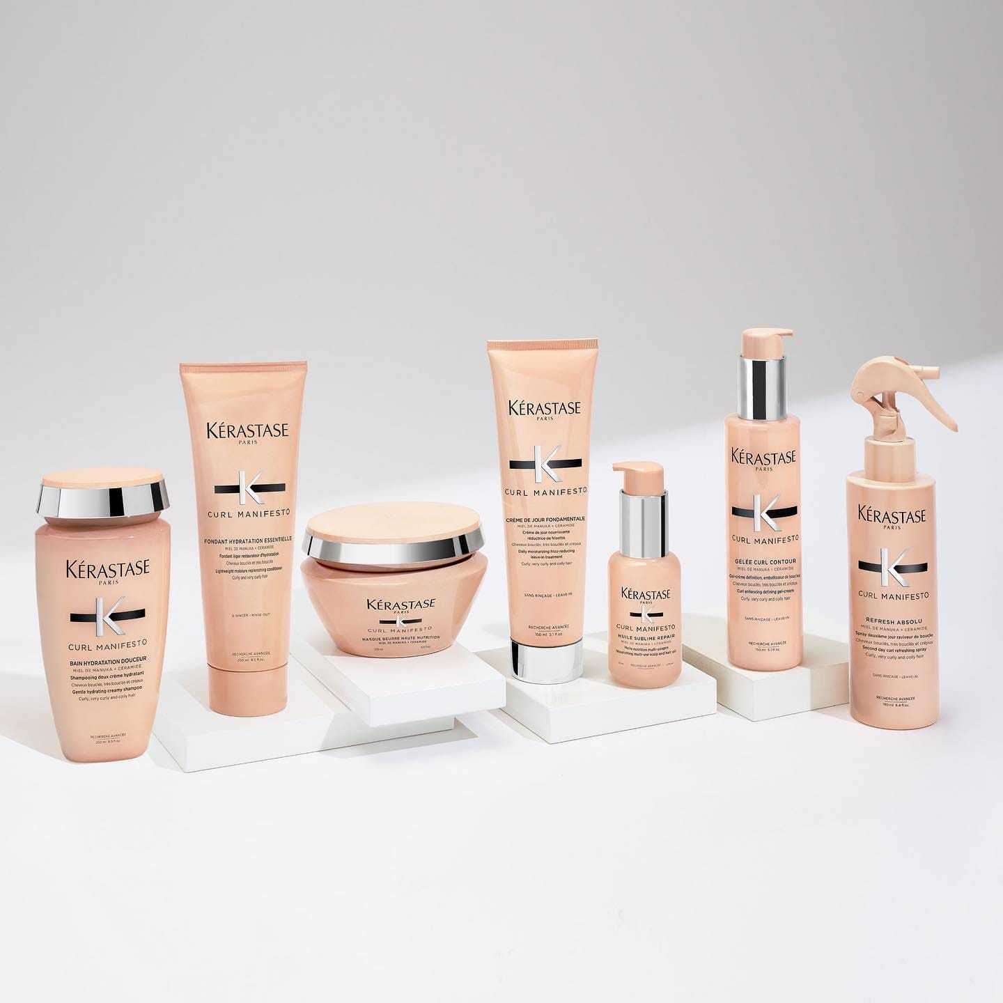 Range of Kerastase hair care products on a white background.